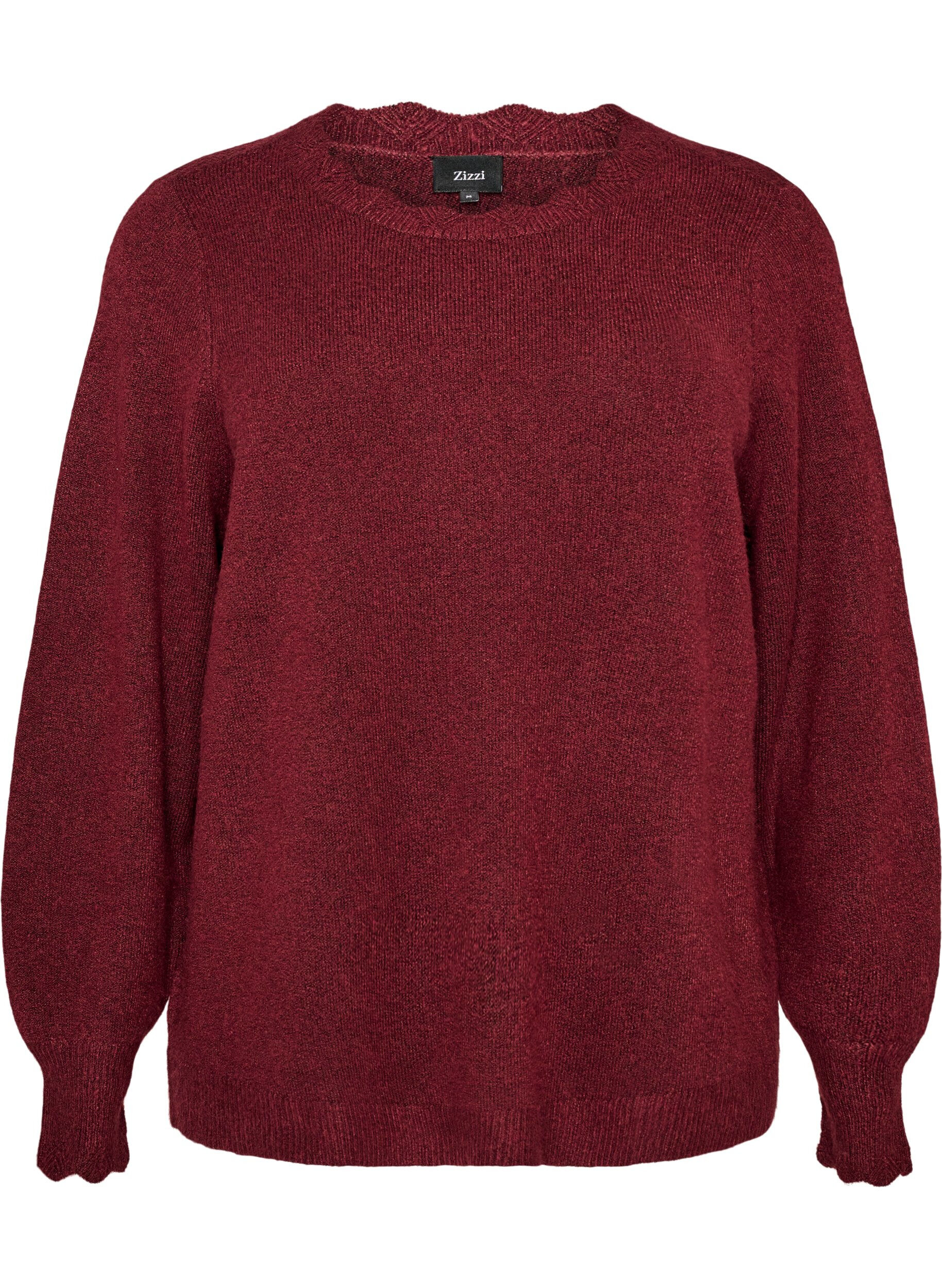 Knitted blouse with wavy edges