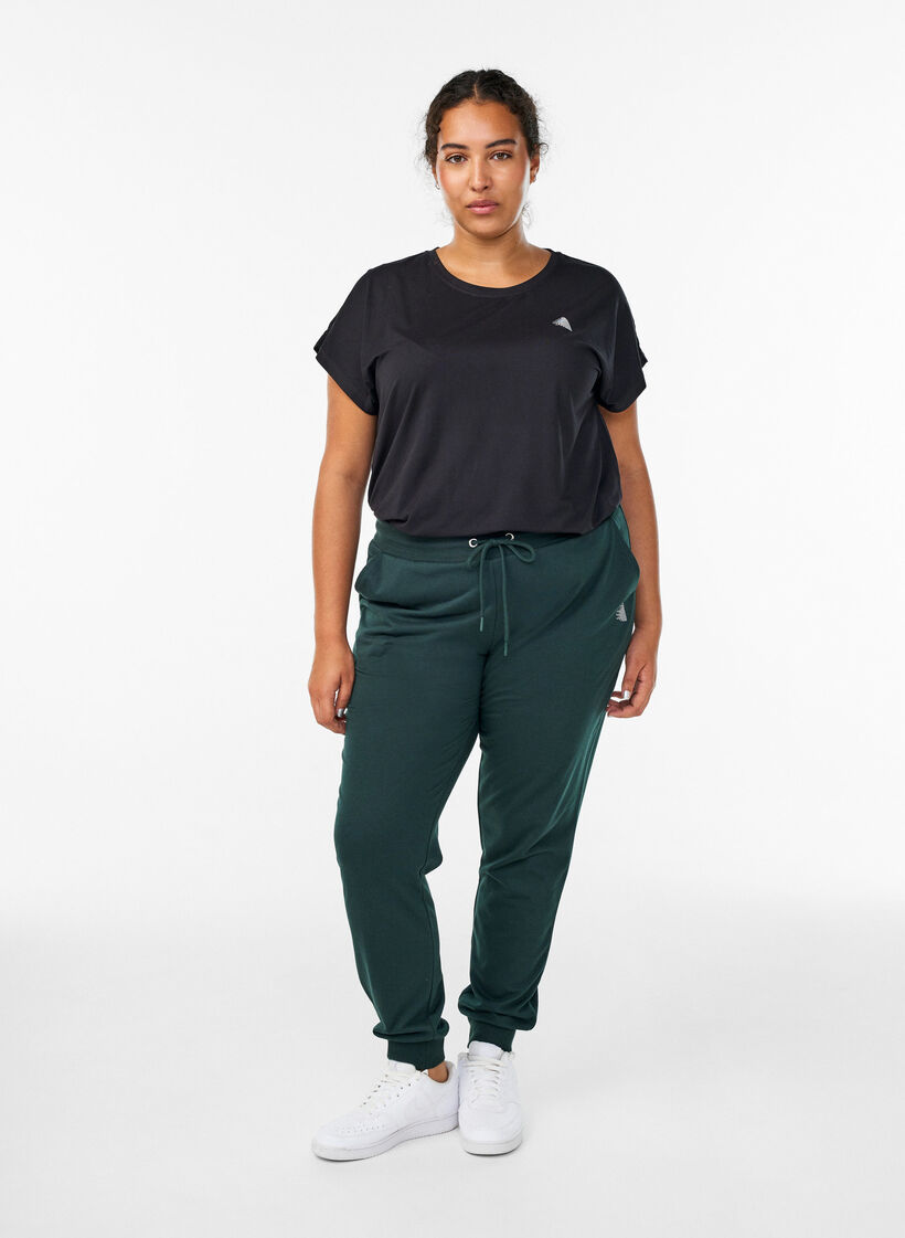 Loose tracksuit trousers with pockets, Green, Model image number 0