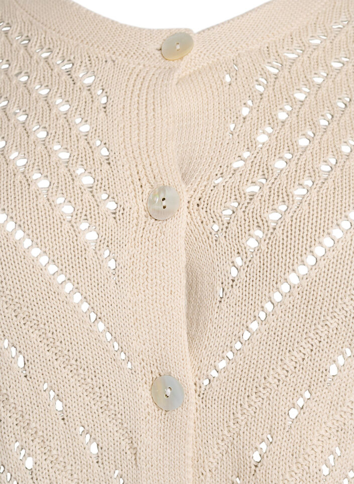 Short knitted cardigan with eyelet pattern, Sandshell, Packshot image number 2