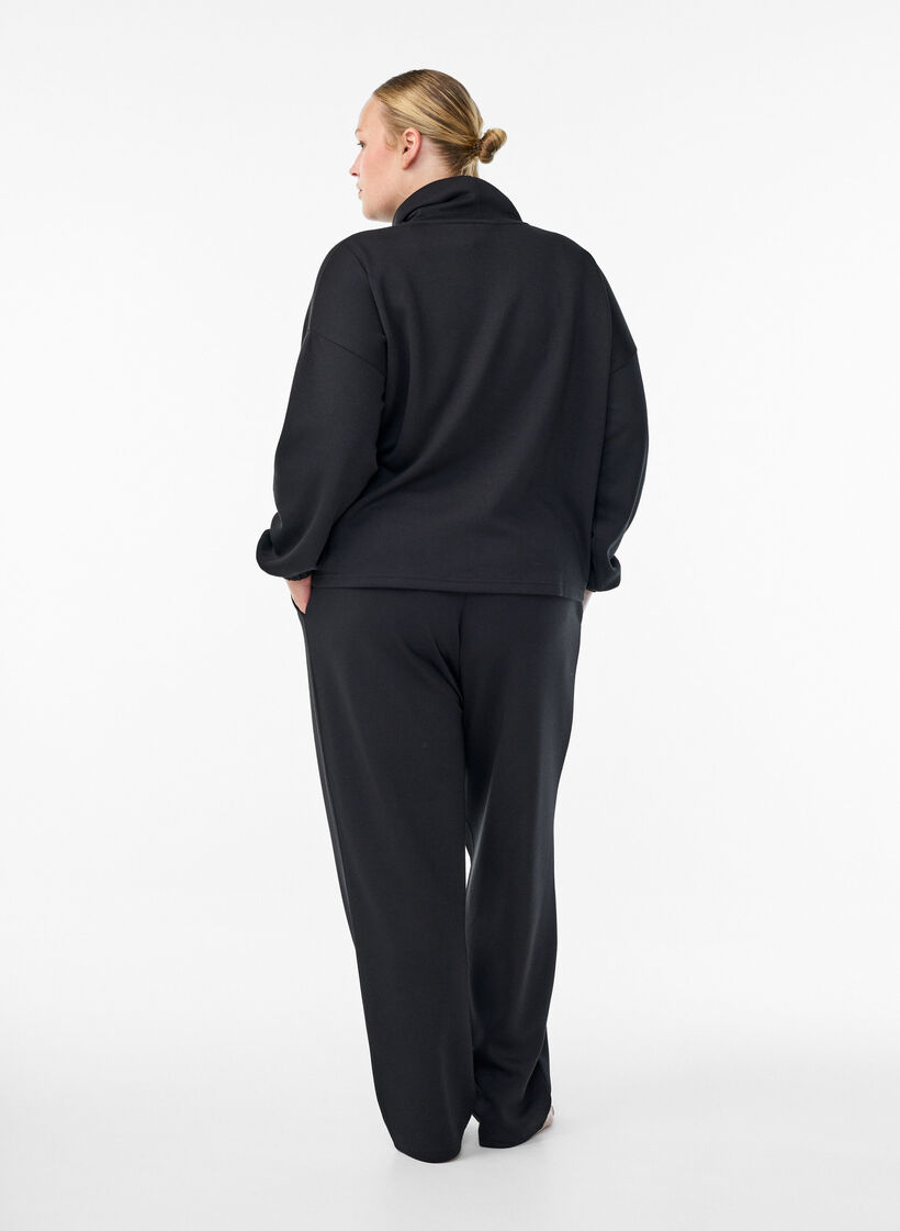 Loose trousers in modal mix, Black, Model image number 1