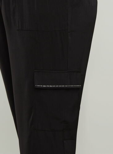 Loose trousers with large pockets, Black, Model image number 1
