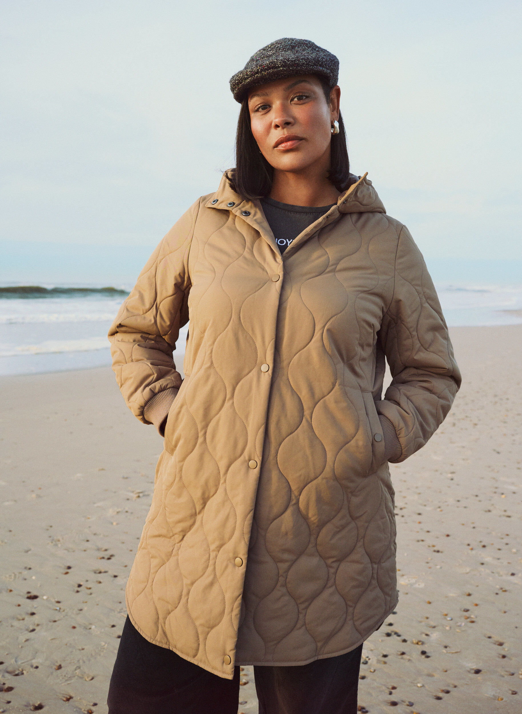 Mid-length quilted jacket with a hood