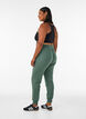 Loose workout trousers with pockets, Green, Model image number 1