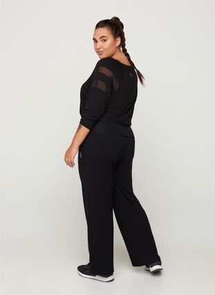 Flared sports trousers made from a viscose mix, Black, Model image number 0
