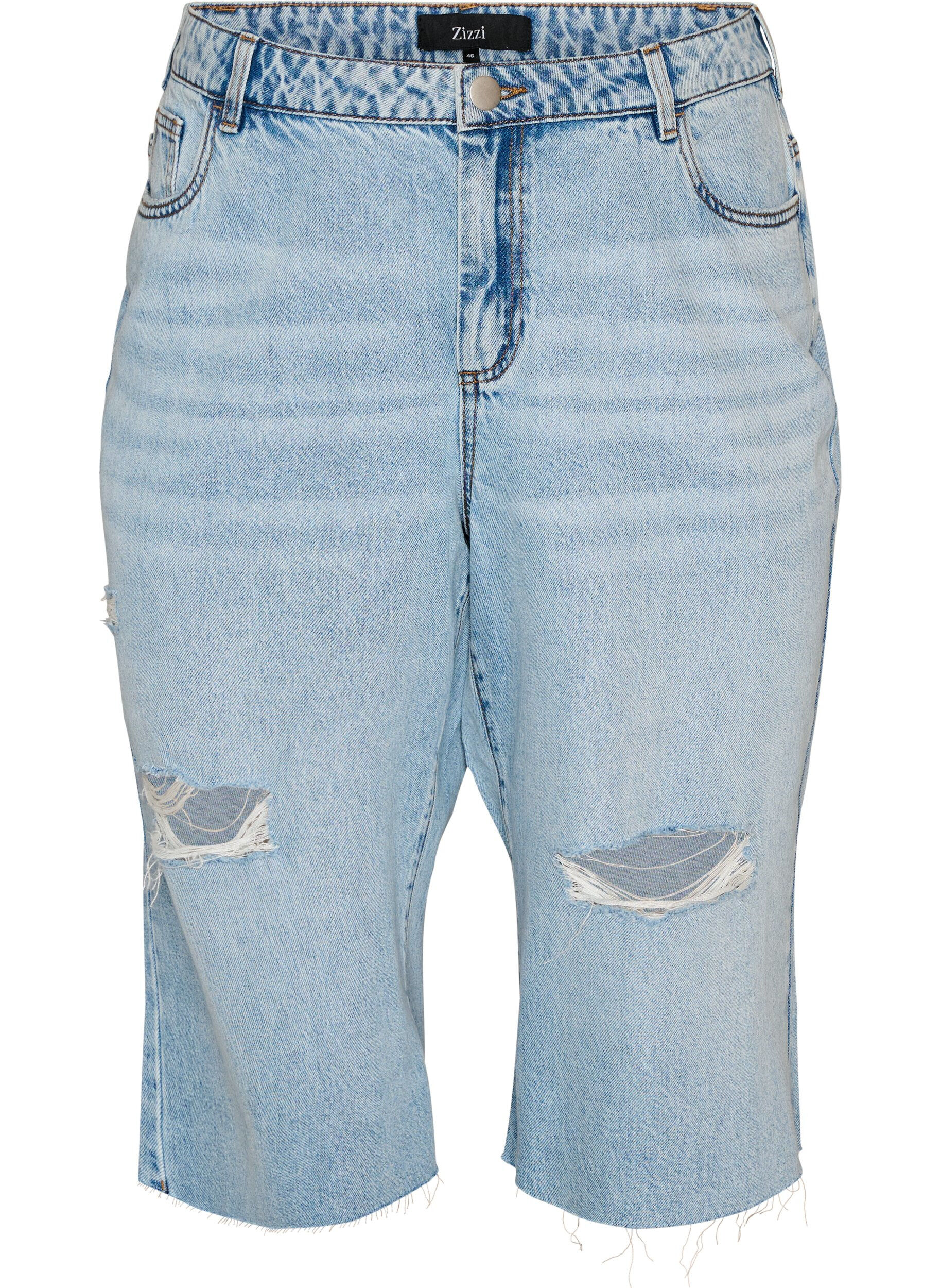 Cropped jeans with a distressed look and raw edges