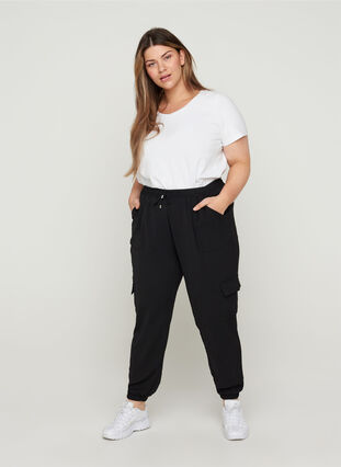 Loose trousers with large pockets, Black, Model image number 0