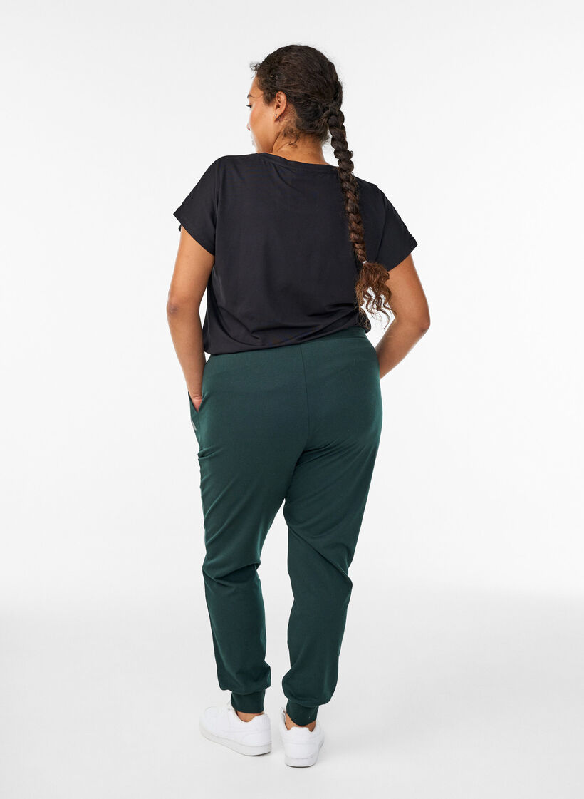 Loose tracksuit trousers with pockets, Green, Model image number 1