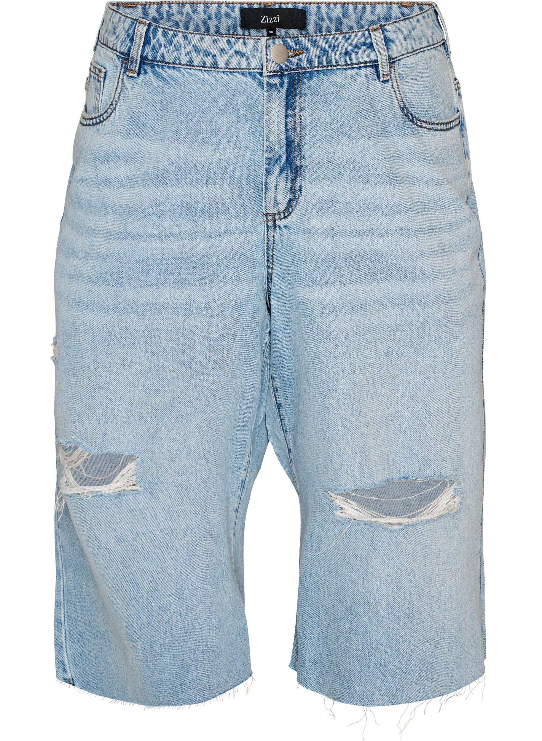 Cropped jeans with a distressed look and raw edges