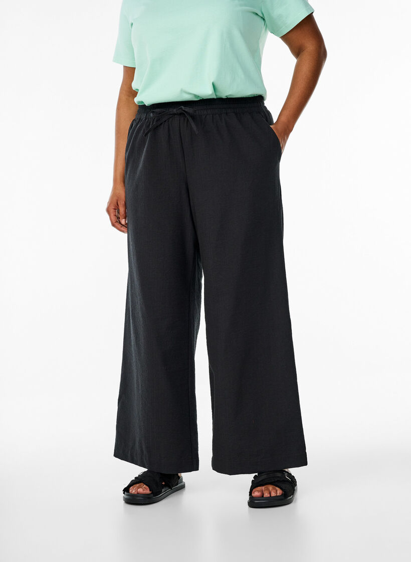 Loose trousers with high waist and pockets, Black, Model image number 2