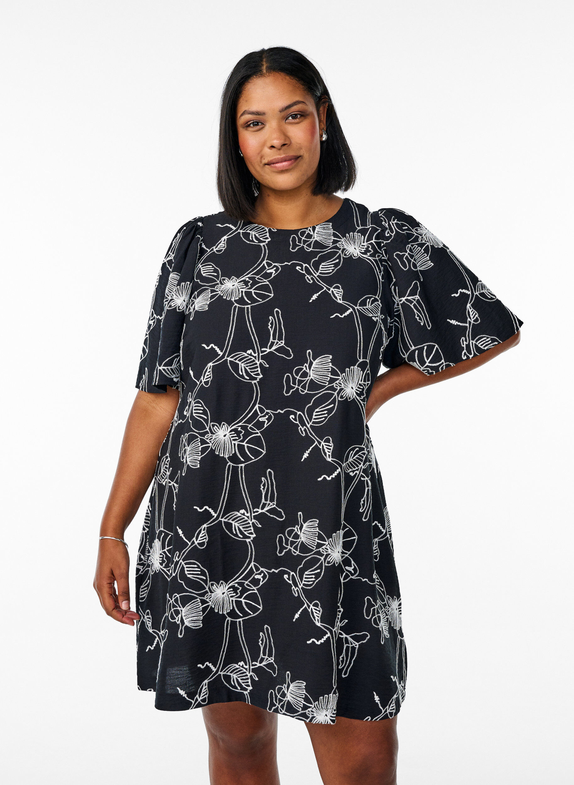 Short A-line dress with embroidered pattern, Black, Model