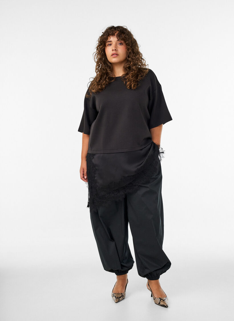 Balloon trousers with pockets and an elasticated waistband, Black, Model image number 1