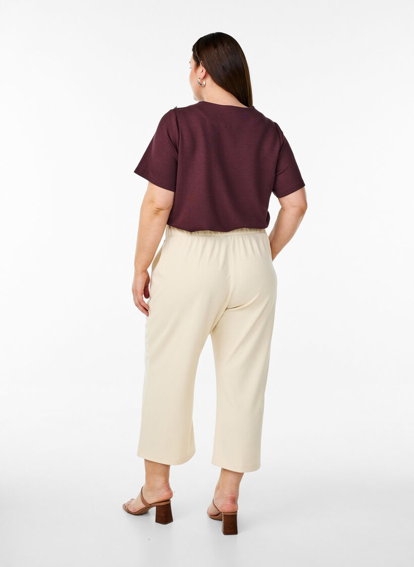Ankle length trousers with loose fit, Beige, Model image number 1