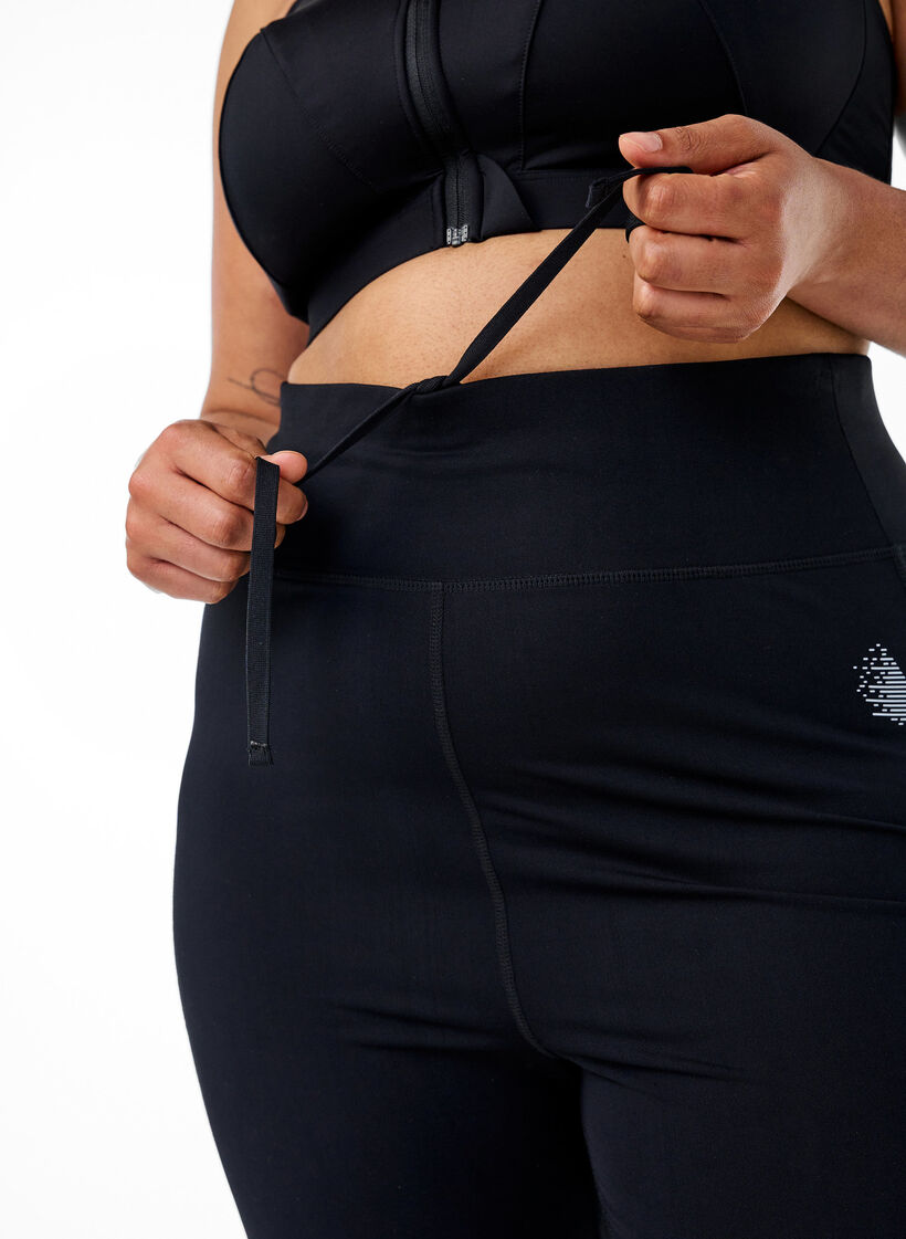Running tights with light compression and side pockets, Black, Model image number 4