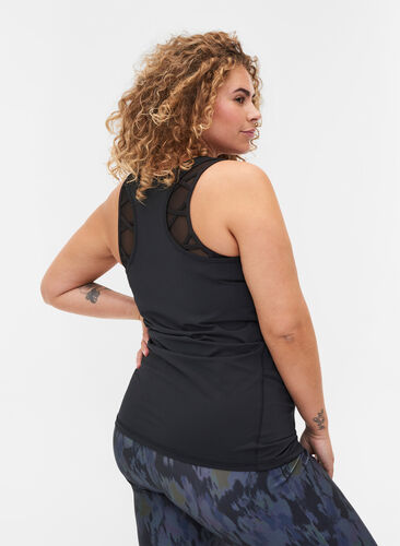 Close-fitting sports top with pockets, Black, Model image number 1