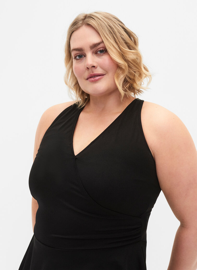 Swim dress with crossed back and skirt, Black, Model image number 2
