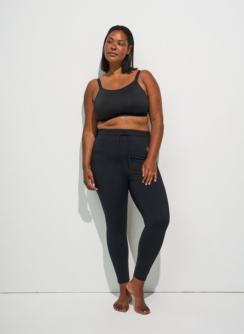 7/8 training tights with pockets, Black, Model image number 1