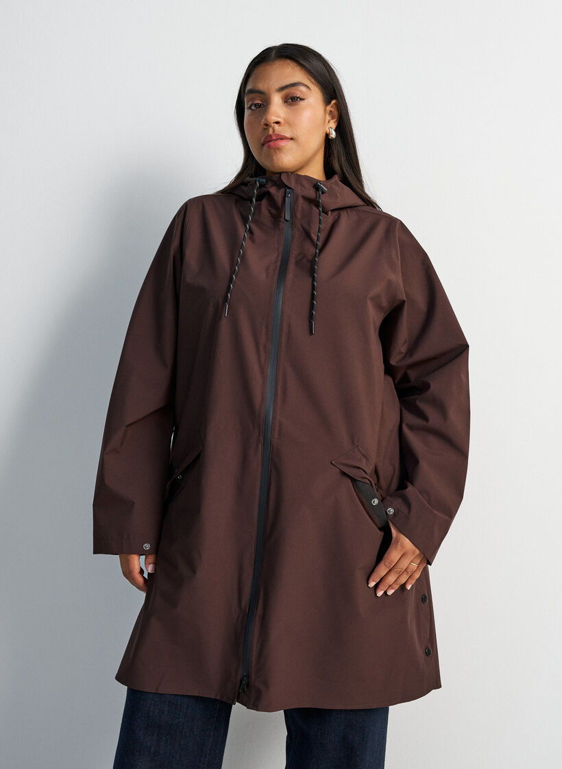 Raincoat with pockets and hood, Brown, Model image number 0