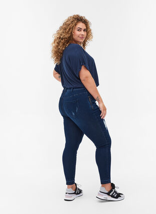 Super slim Amy jeans with distressed look, Dark blue denim, Model image number 1