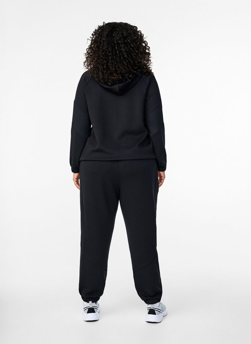 Sweatpants with textured detail, Black, Model image number 1