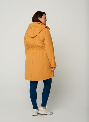 Long, hooded softshell jacket, Spruce Yellow, Model image number 1