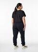 Loose workout trousers with pockets, Black, Model image number 2