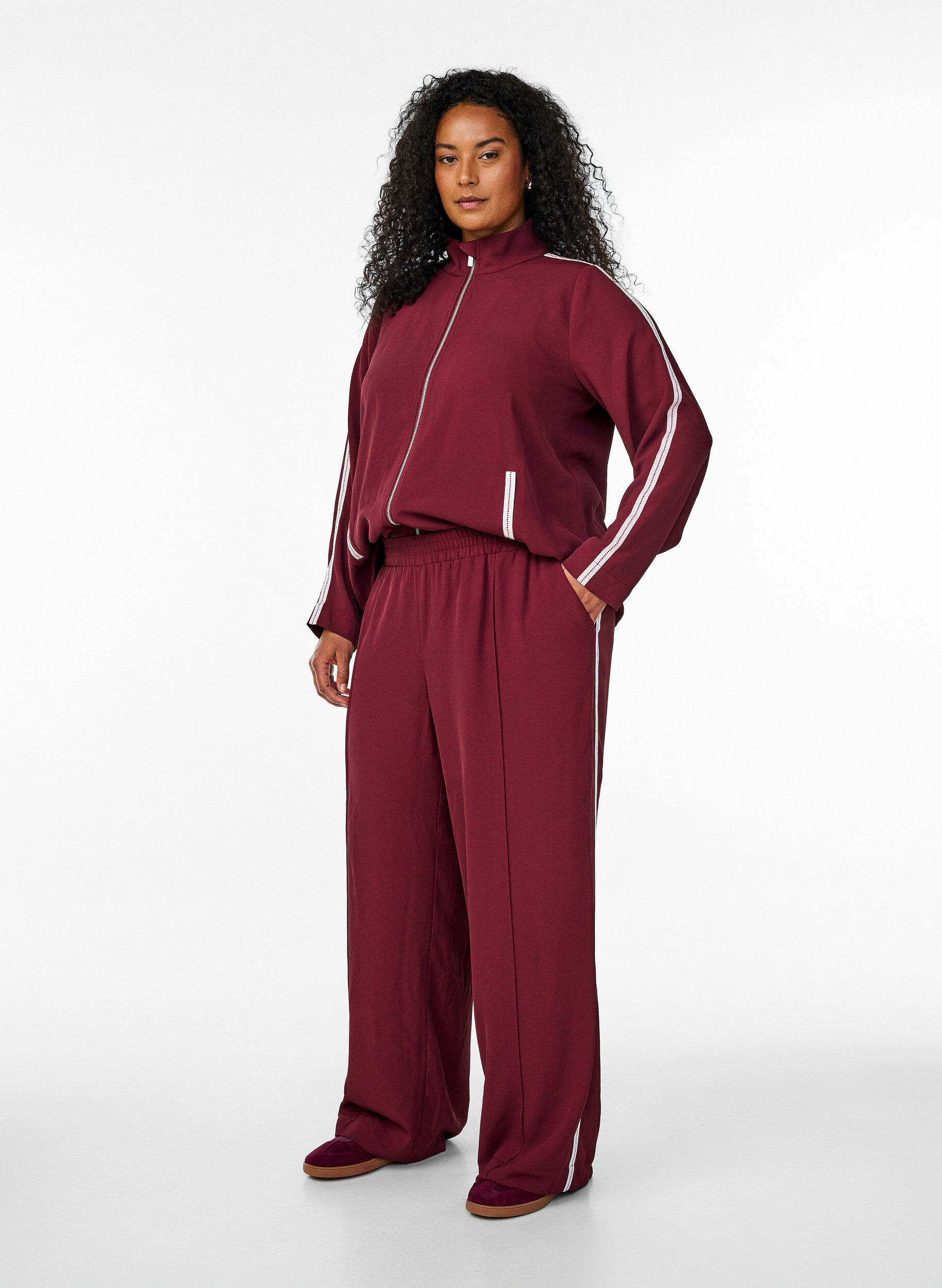 Sporty trousers with straight legs and side stripes, Dark Bordeaux, Model