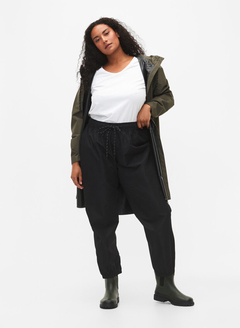 Rain pants with elastic and drawstring, Black, Model image number 0