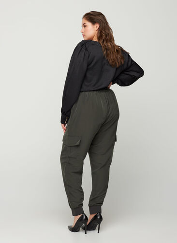 Cargo trousers with side pockets, Peat, Model image number 1