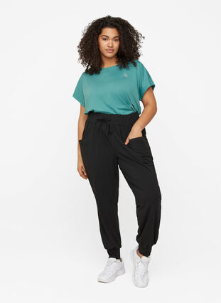 Loose trousers with pockets, Black, Model image number 2