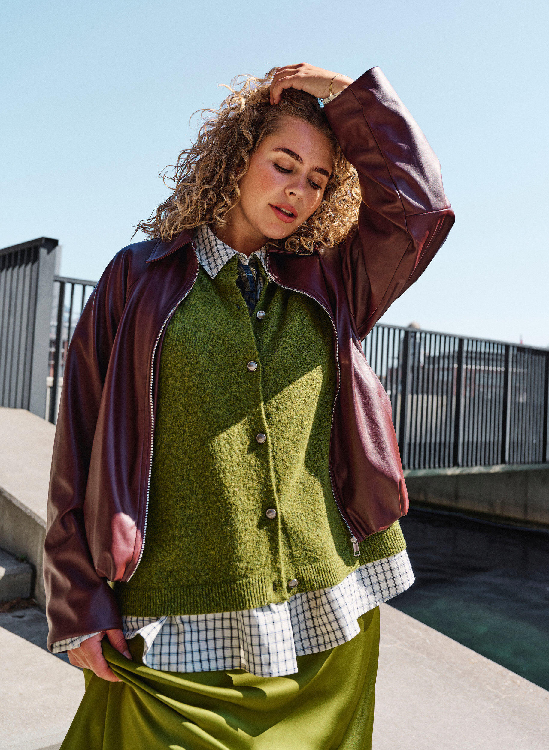 Faux leather bomber jacket with a drawstring hem