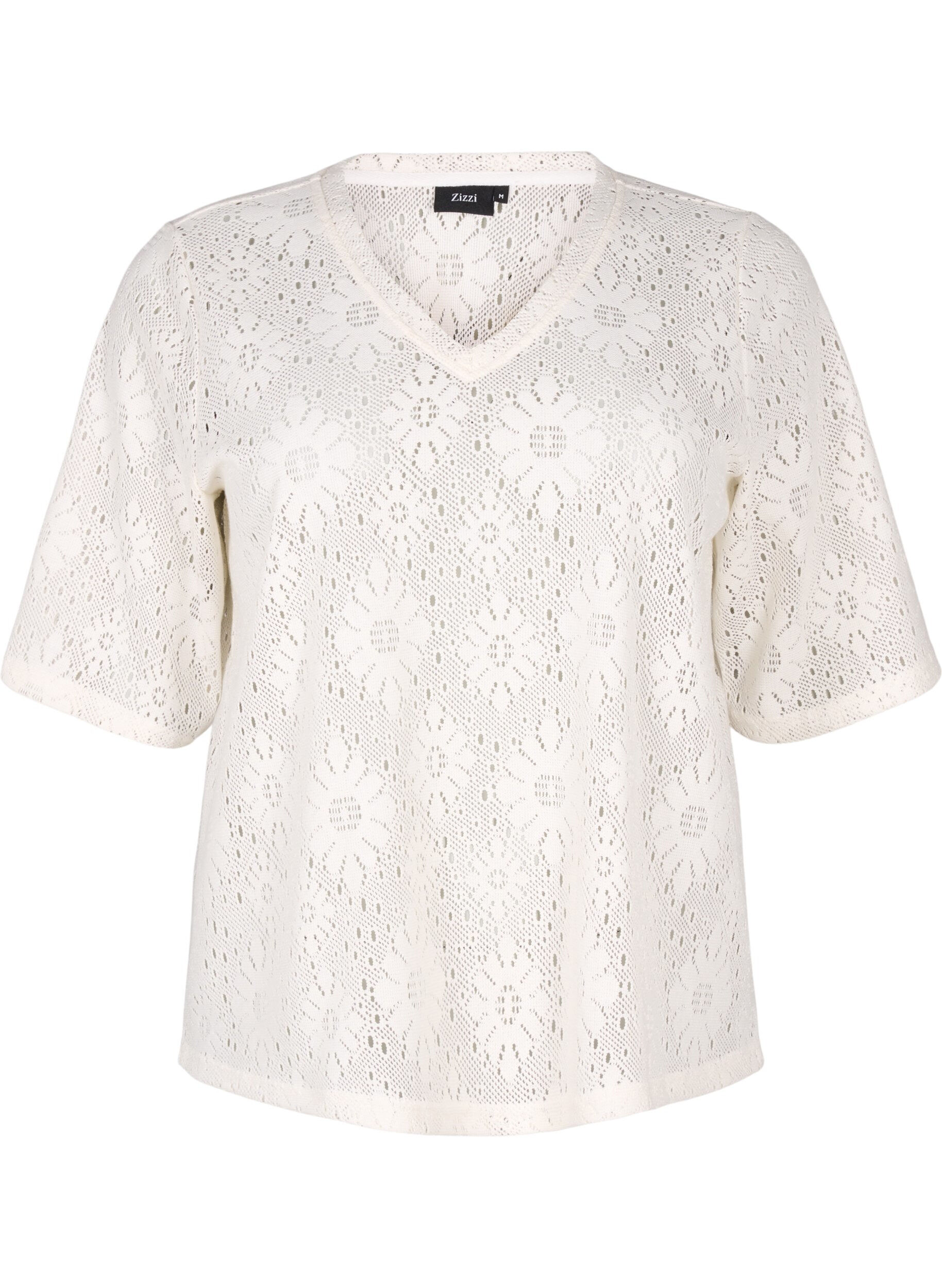 Blouse with an openwork pattern and short sleeves