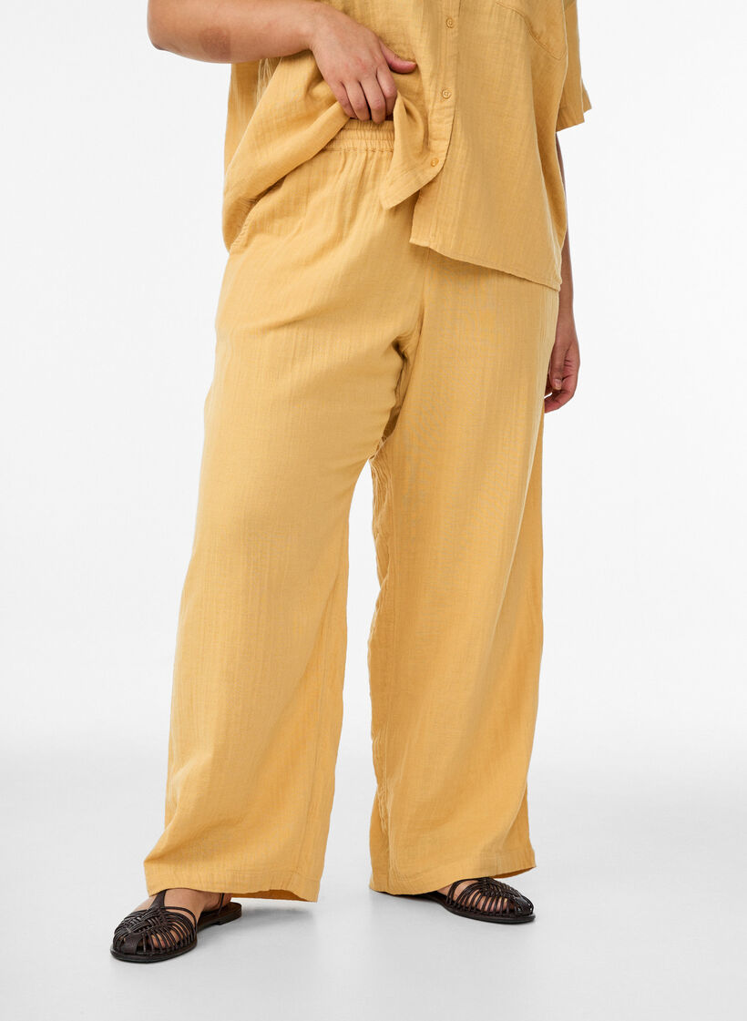 High-waisted cotton muslin trousers with loose legs, Yellow, Model image number 2