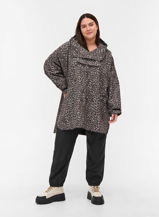 Rain poncho with hood and print, Brown Leo, Model image number 2