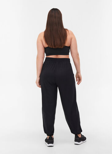 Loose exercise trousers with pockets in viscose, Black, Model image number 1