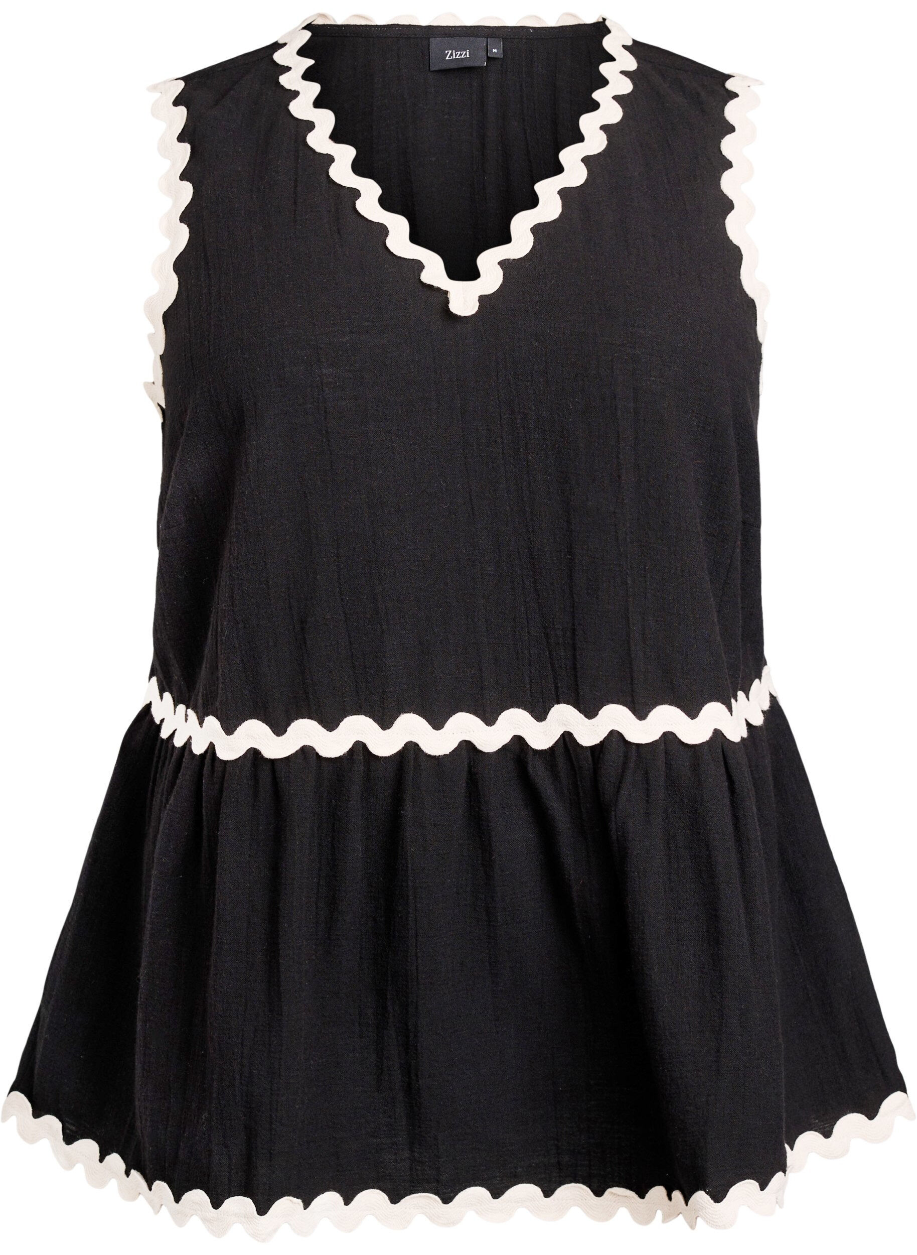 Sleeveless top with wavy contrast edges