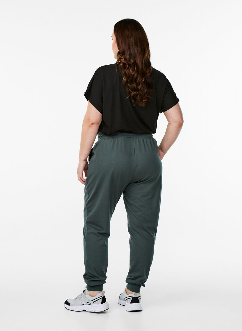 Loose tracksuit trousers with pockets, Green, Model image number 1