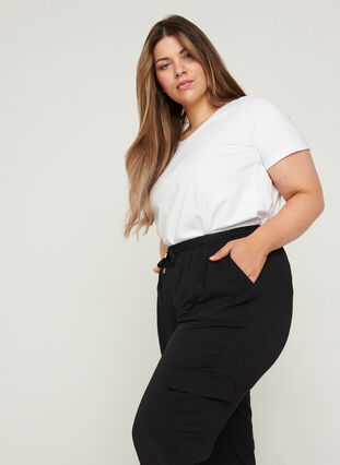 Loose trousers with large pockets, Black, Model image number 2