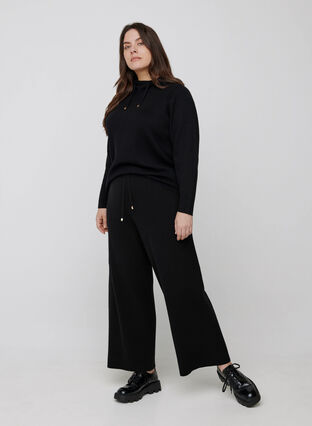 Loose knitted trousers with a drawstring, Black, Model image number 1