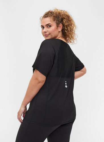 Reflective, solid-coloured exercise t-shirt, Black, Model image number 1