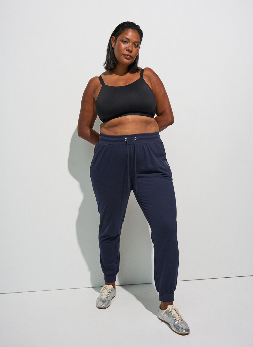 Loose workout trousers with pockets, Blue, Model image number 1