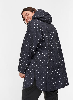 Rain poncho with hood and print, Black w/ white dots, Model image number 1