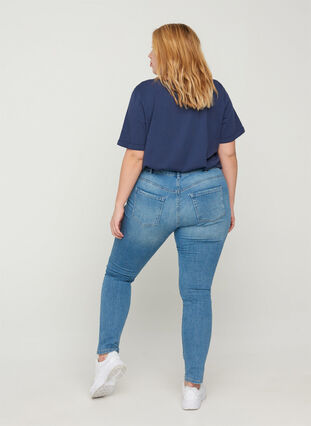 Extra slim Sanne jeans with distressed details, Light blue denim, Model image number 1