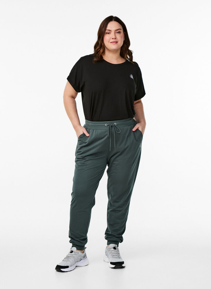 Loose tracksuit trousers with pockets, Green, Model image number 0