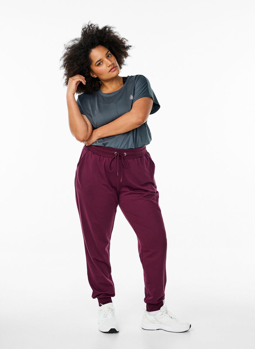 Loose tracksuit trousers with pockets, Red, Model image number 1