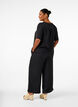 Loose trousers with elasticated waistband and pockets, Black, Model image number 1