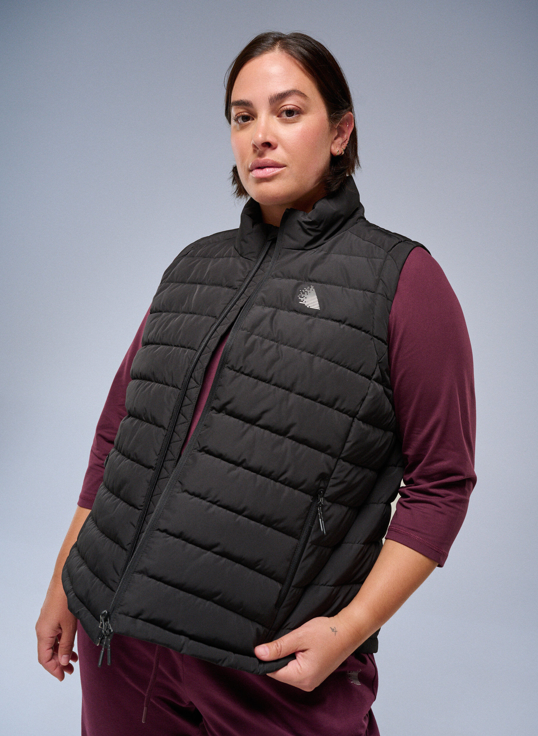 Sporty padded vest with zipper and pockets