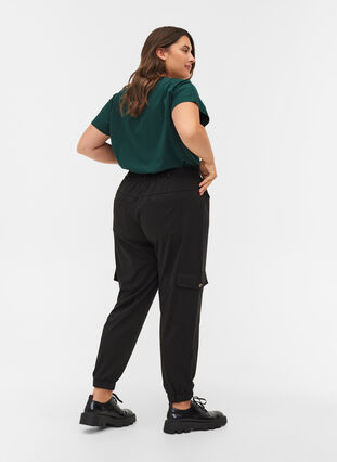 Loose trousers with elasticated trim and pockets, Black, Model image number 1