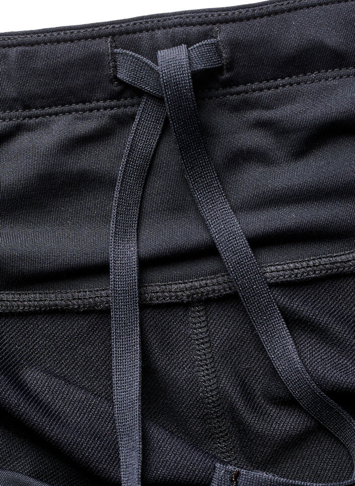 Running tights with light compression and side pockets, Black, Packshot image number 3