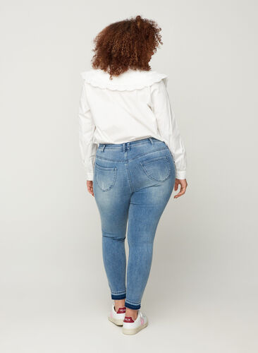 Super slim Amy jeans with distressed look, Blue denim, Model image number 1