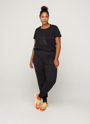 Loose trousers with a zip and pockets, Black, Model image number 2